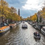 things to do in Amsterdam with kids featured image in canel cruise view