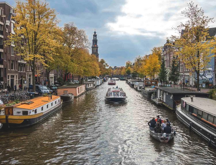 things to do in Amsterdam with kids featured image in canel cruise view