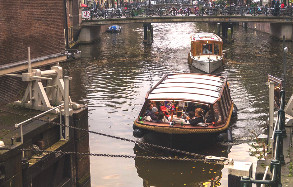 Amsterdam canal with colorful autumn leaves in October