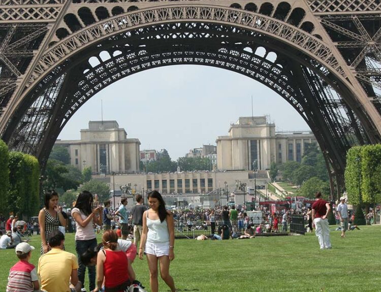 things to do in paris with family- Family visiting Eiffel Tower in Paris for a fun day out