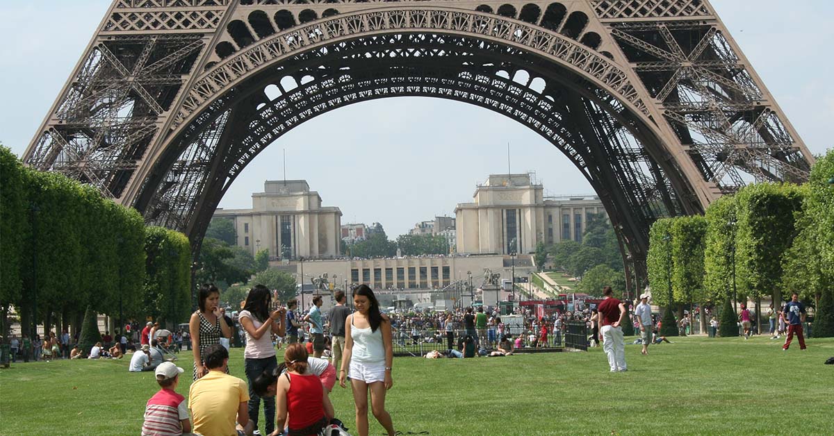 things to do in paris with family- Family visiting Eiffel Tower in Paris for a fun day out