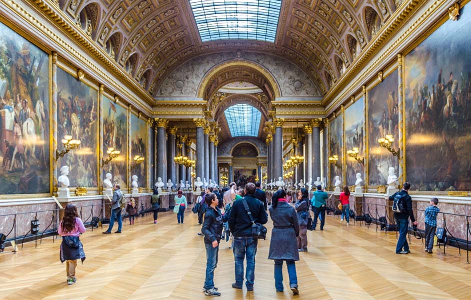 Family exploring child-friendly exhibits at the Louvre Museum in Paris