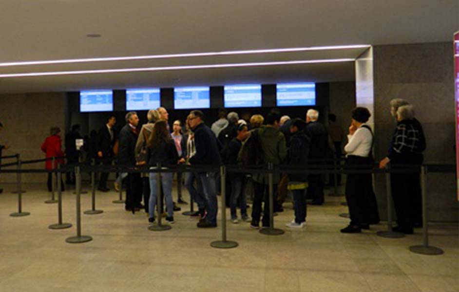 Visitors buying last-minute tickets at Rijksmuseum ticket counter